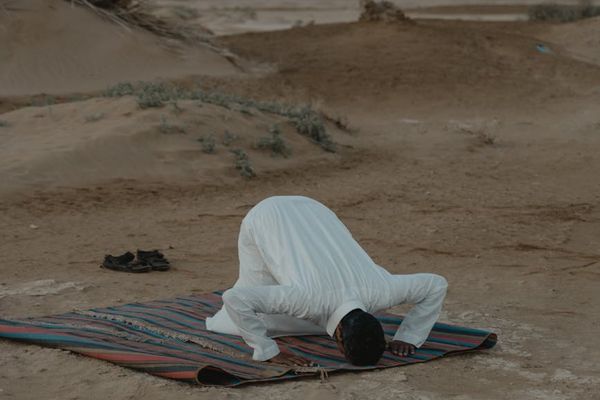 A person meditating after a workout, finding a moment of peace.